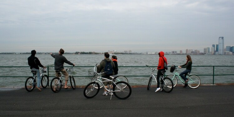 There are several ways to bike through NYC, such as on a bike path along the East River